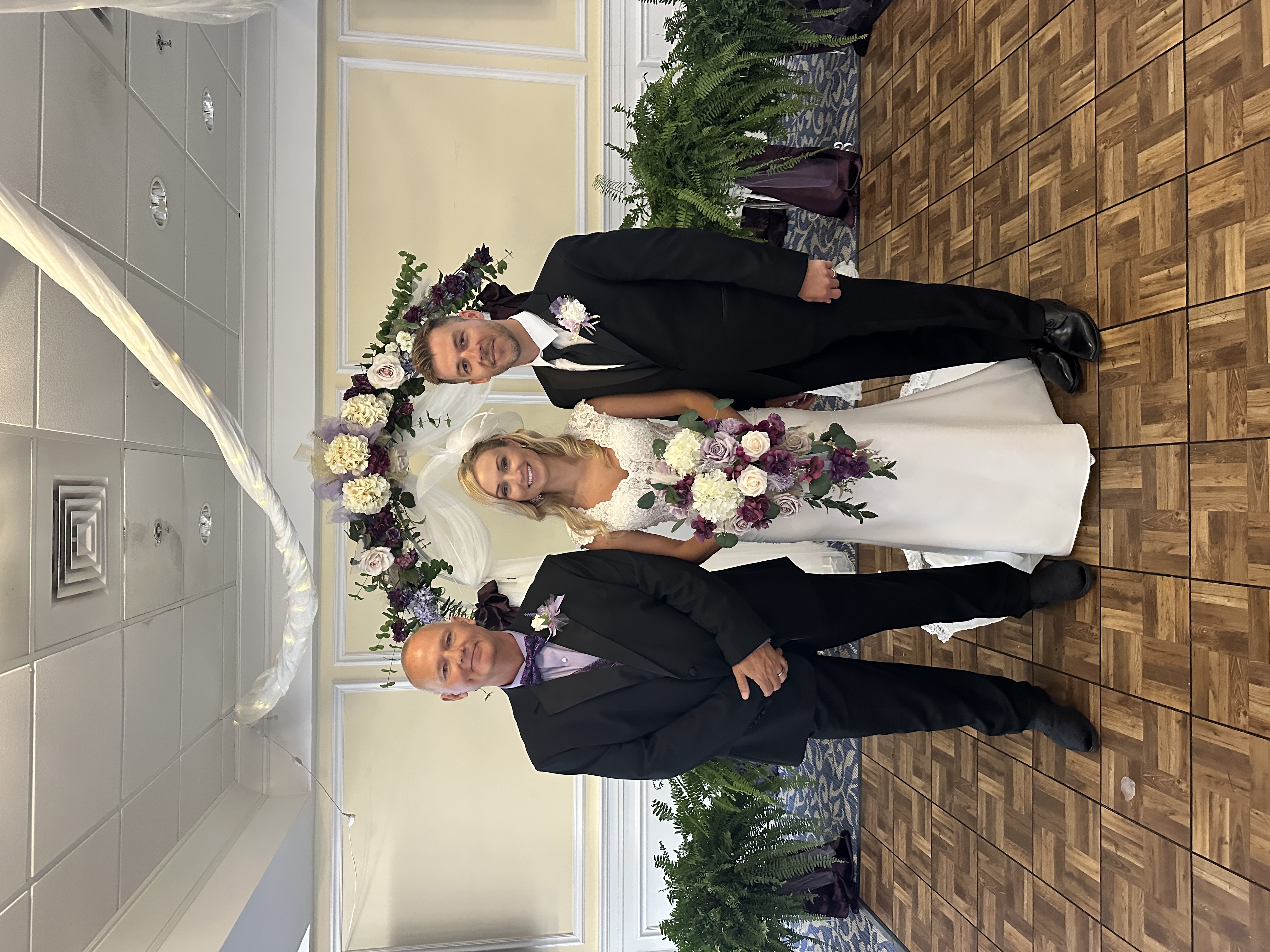 Kevin with bride and groom after ceremony